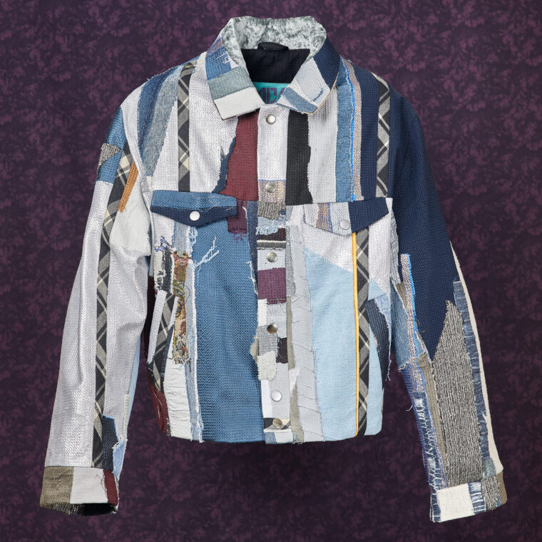 This is an image of a scrap jacket from the brand MiJA. It consists mostly of mix of silver and blue fabrics.