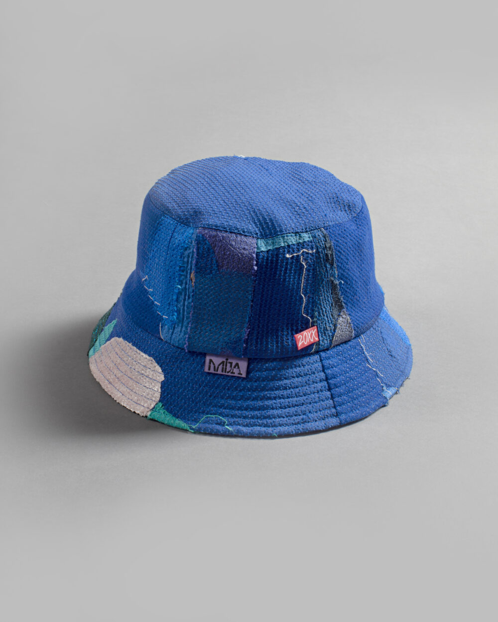 This is an image of a white scrap bucket hat which was made from fabric waste.