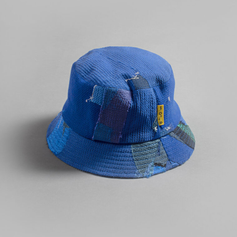 This is an image of a white scrap bucket hat which was made from fabric waste.