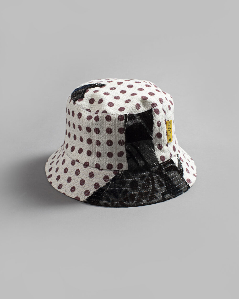 This is an image of a white scrap bucket hat which was made from fabric waste.