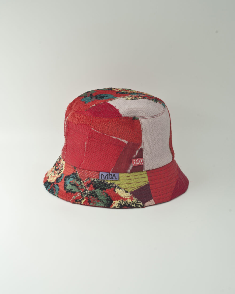 This is an image of a white scrap bucket hat which was made from fabric waste.