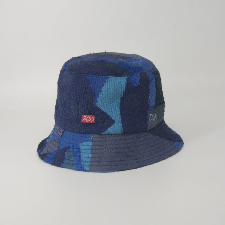 This is an image of a scrap bucket hat from the brand MiJA. It consists of mix of blue fabrics.